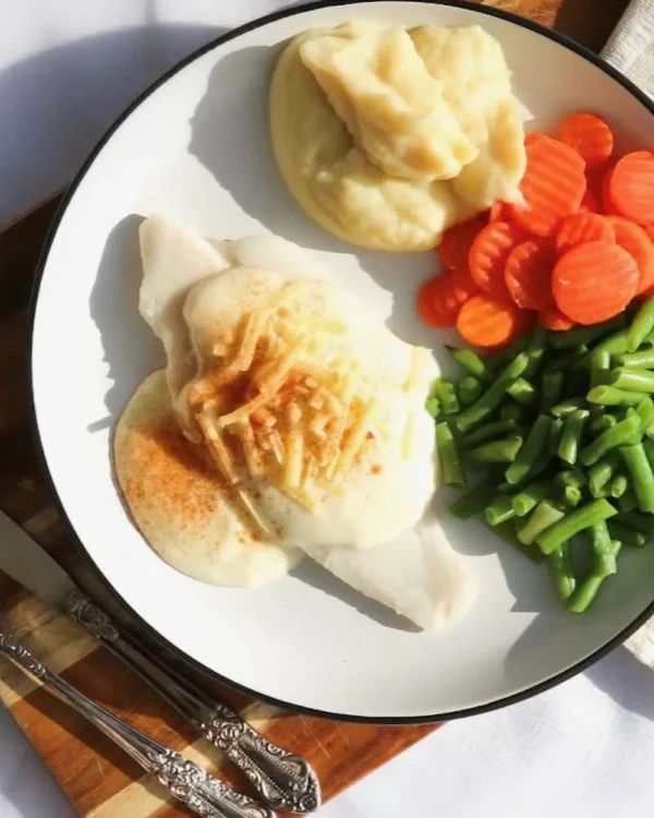 Baked fish with mornay sauce, mash potato, beans, carrots