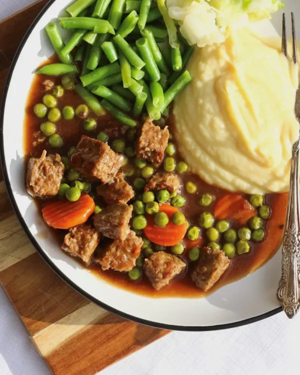 Lamb casserole with mash, beans, cabbage