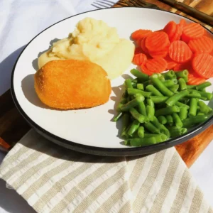 Chicken Kiev with mash potatoes and vegetables