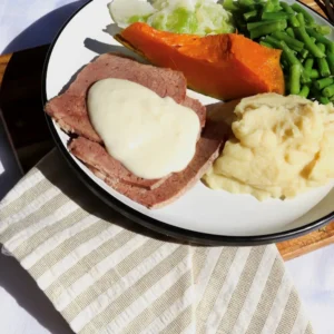 Corned Silverside with white sauce and vegetables