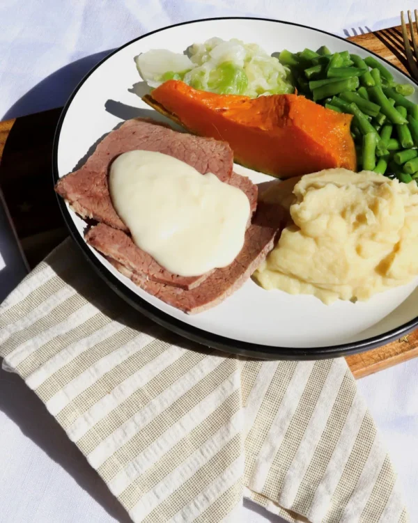 Corned Silverside with white sauce and vegetables