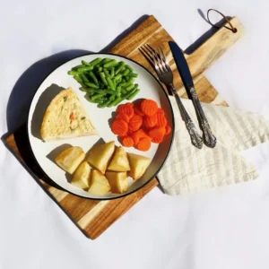 Spinach quiche with roast potatoes, carrots, beans