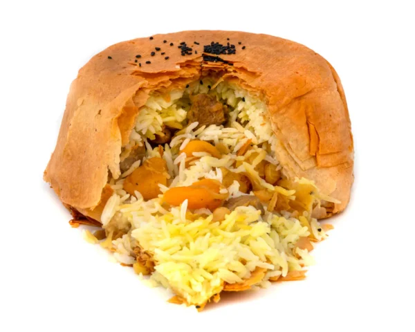 Azerbaijanian savory pastry filled with saffron infused rice, lamb, and dried fruits